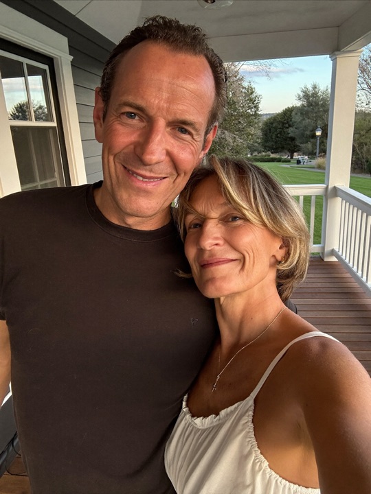 Member couple selfie on their porch